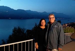 Parker and husband pose in front of Lake Garda